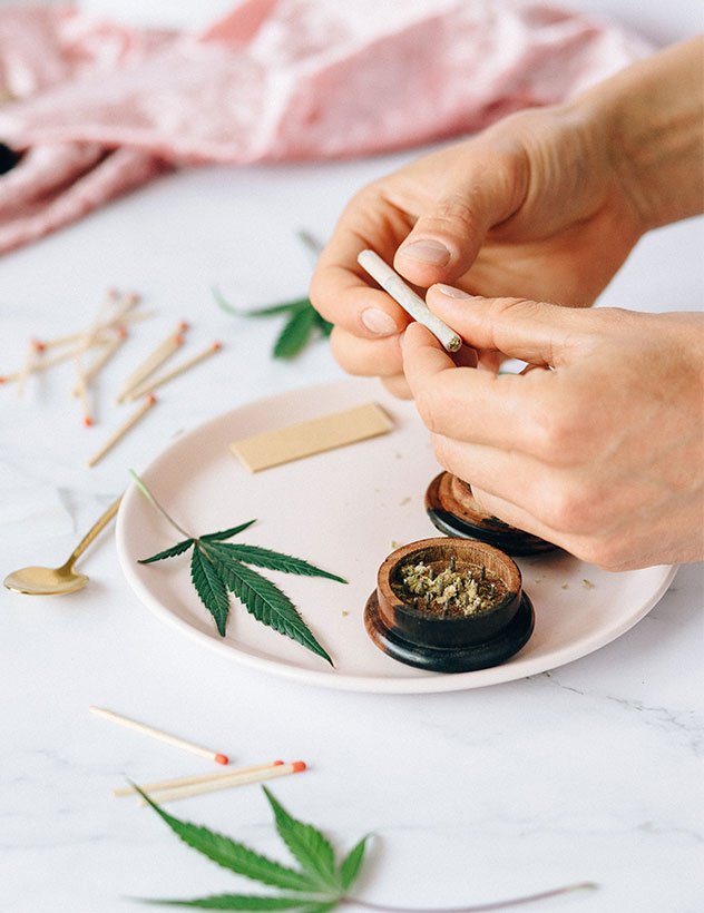 Person Rolling Cannabis Person Rolling Cannabis